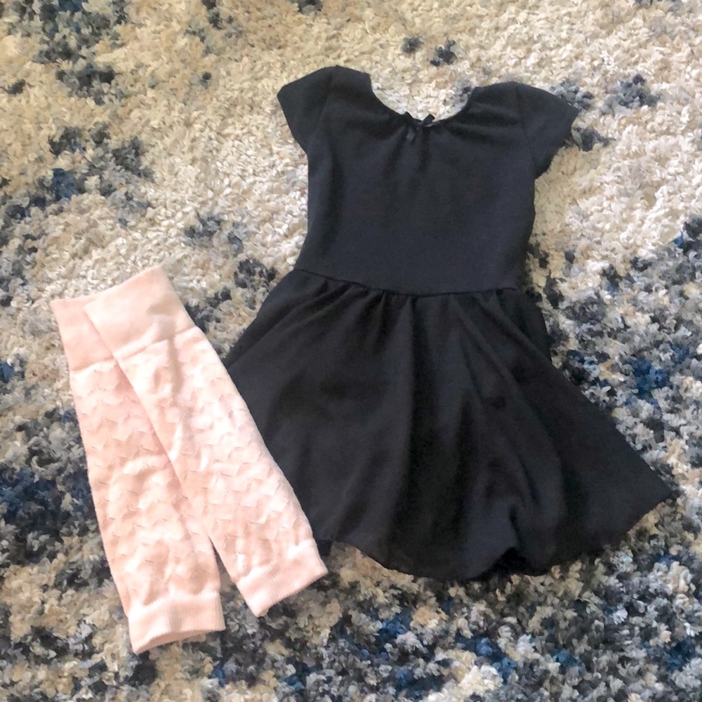 Black skirted ballet leo and pink leg warmers. CS